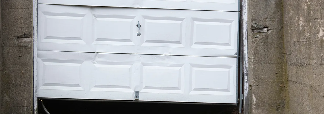 Garage Door Got Hit By A Car Dent Removal in Quincy, IL